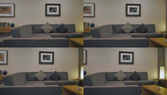 带灰色沙发的极简主义客房高清在线视频素材下载