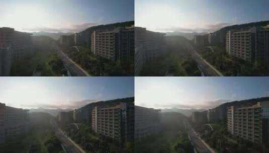 航拍清晨日出时分的威海孙家疃雨润城公寓楼高清在线视频素材下载