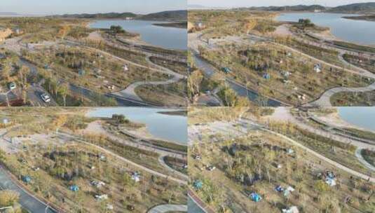 航拍九江芳兰湖湿地公园露营场景高清在线视频素材下载