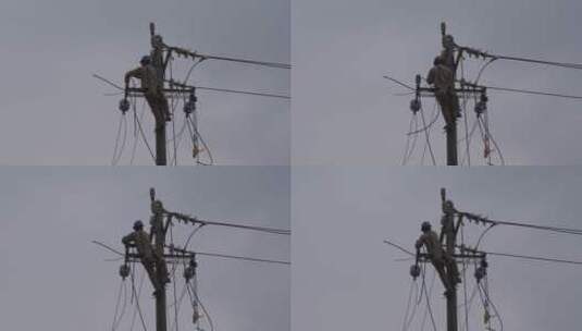 电工电线杆抢修电路修理工雨天安装电线电路高清在线视频素材下载