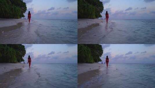 美女走在黄昏下的海滩上高清在线视频素材下载