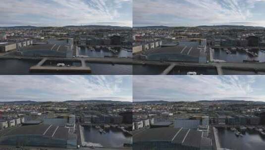海港水上公园和酒店建筑。挪威特隆赫姆港白天。天线高清在线视频素材下载