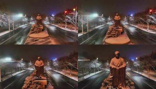 航拍鉴真路扬州雪景夜景鉴真像飘雪高清在线视频素材下载