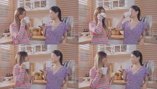 亚洲美女朋友在厨房一起喝一杯咖啡。高清在线视频素材下载