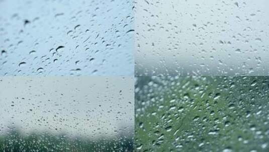 下雨的玻璃窗，玻璃上的雨滴，雨珠高清在线视频素材下载