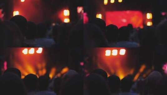 观众观看现场音乐会时舞台上的闪光灯高清在线视频素材下载