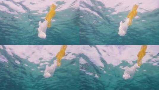 4K-海洋污染海洋垃圾垃圾袋漂浮在海水中高清在线视频素材下载