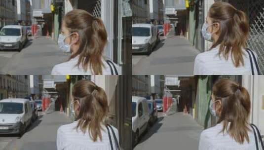 女人戴着口罩步行在城市街道高清在线视频素材下载