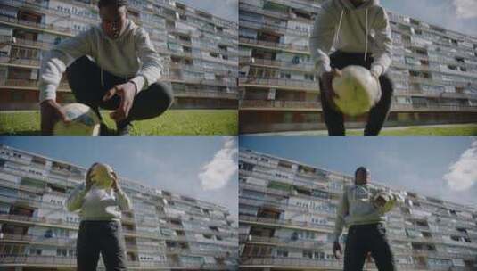 青年从地上捡起足球高清在线视频素材下载