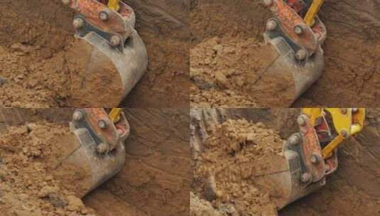 挖掘机铲斗铲起泥土并抬起高清在线视频素材下载