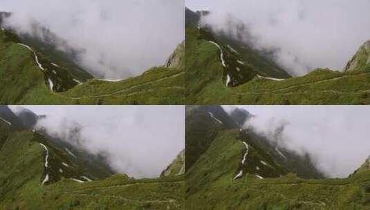 航拍雾气缭绕的山顶高清在线视频素材下载