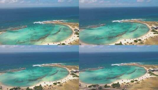 阿鲁巴岛惊人的婴儿海滩和阿鲁巴岛的海岸加勒比白色海滩与蓝色海洋热带海滩高清在线视频素材下载
