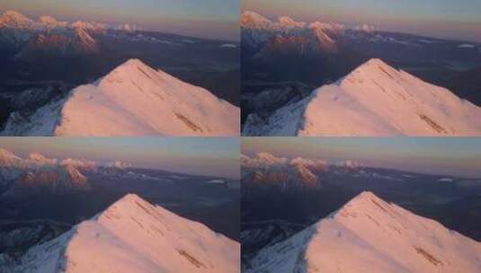 日落时分，无人机俯瞰积雪覆盖的阿尔卑斯山高清在线视频素材下载
