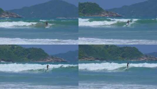 4K拍摄海南万宁石梅湾海上运动员冲浪高清在线视频素材下载