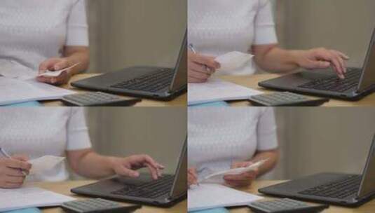 女人在办公室的桌子上计算账单高清在线视频素材下载