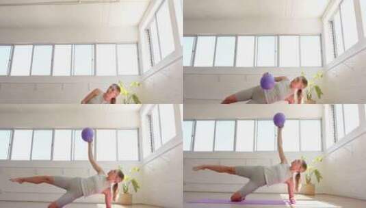 一个年轻的高加索女人用一个紫色的球做侧板高清在线视频素材下载