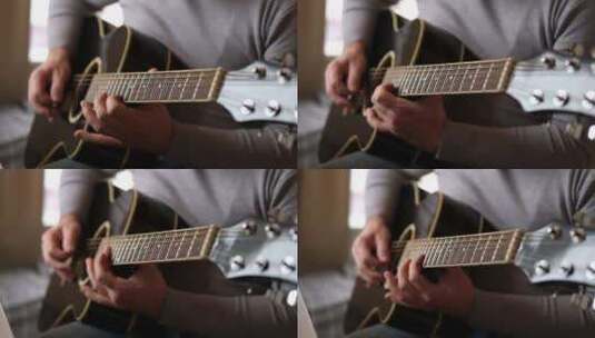弹吉他拨弄黑色原声吉他音乐家演奏音乐人手高清在线视频素材下载