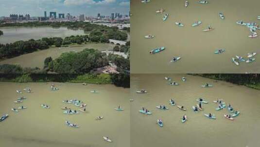 广州塔下文化馆旁海珠湖上儿童浆板航拍视频高清在线视频素材下载