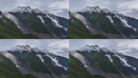 航拍云雾缭绕的四川甘孜海螺沟景区雪山风光高清在线视频素材下载