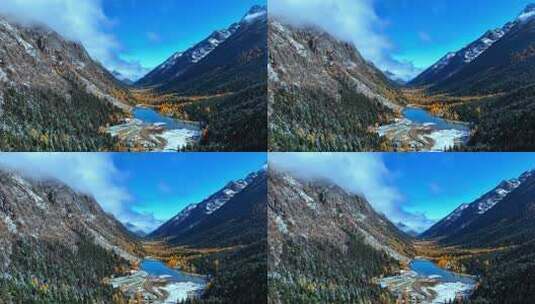 雪山下多彩树林与湖泊相映的美景高清在线视频素材下载