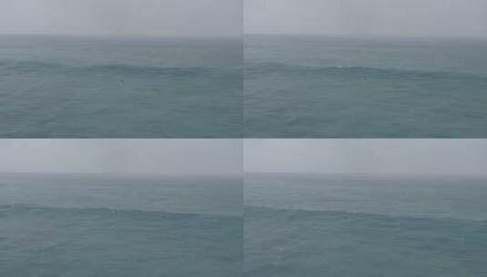航拍人在海上冲浪高清在线视频素材下载