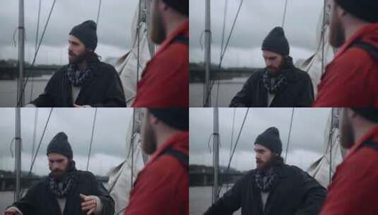 男人站在船上说话高清在线视频素材下载