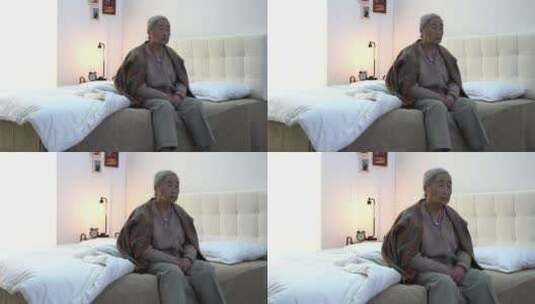 孤独的老人坐在床上高清在线视频素材下载