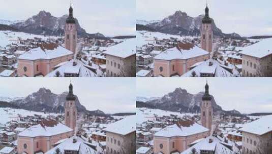 航拍阿尔卑斯山积雪覆盖的蒂罗尔村庄教堂高清在线视频素材下载