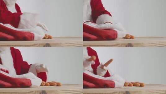 圣诞老人从红袋子里拿出胡萝卜的特写镜头高清在线视频素材下载