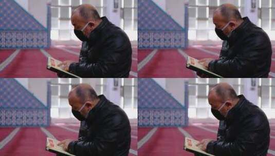 老人戴着面具在清真寺阅读古兰经高清在线视频素材下载