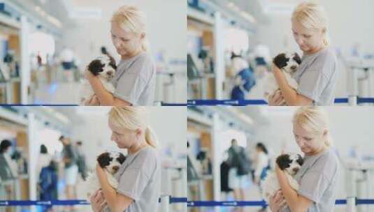 机场里抱着小狗的女人高清在线视频素材下载