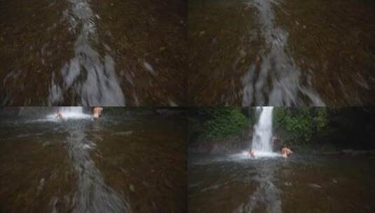 瀑布下游泳者的照片高清在线视频素材下载