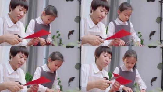 一起做手工剪纸的中国母女高清在线视频素材下载