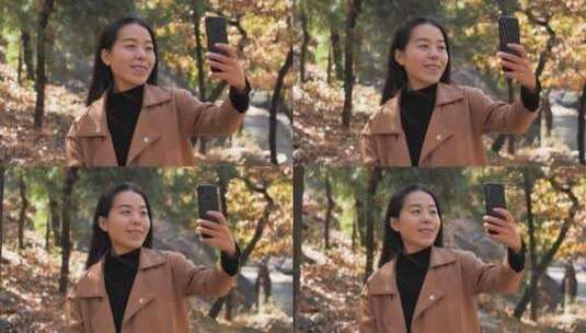 亚洲中国女性树林徒步旅游拍照视频看风景高清在线视频素材下载