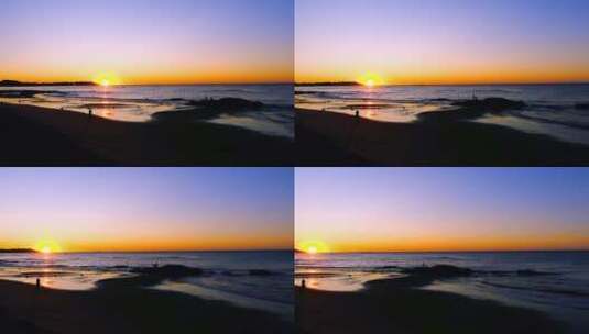 海滩上看日出的人与清晨海景唯美风光高清在线视频素材下载