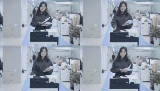 女生站在打印机前面机械的打印文件高清在线视频素材下载