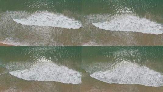 航拍大海海浪涌向海边高清在线视频素材下载