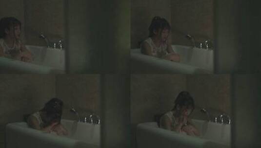 女孩躲在浴缸里哭泣高清在线视频素材下载