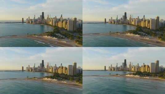 日出时芝加哥北大街海滩的空中降落，背景是芝加哥天际线高清在线视频素材下载