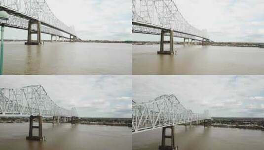 密西西比河的浑水与新月城相连，新奥尔勒上空的双悬臂桥高清在线视频素材下载