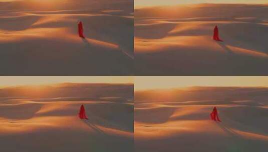 一袭红衣女孩走在沙漠中高清在线视频素材下载