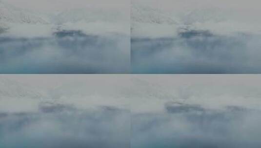 航拍雪后的西藏林芝巴松措云雾缭绕高清在线视频素材下载