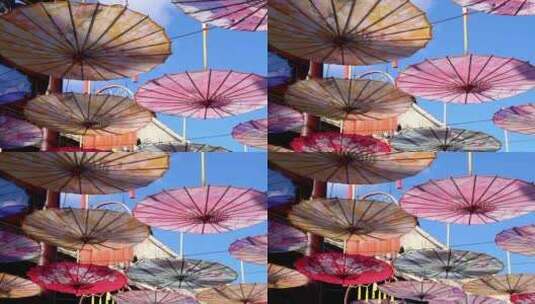 天空下彩色的油纸伞高清在线视频素材下载