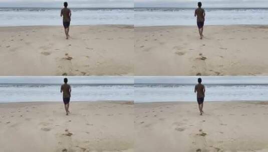 男子赤脚跑向海边高清在线视频素材下载