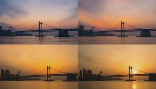 延时拍摄海边大桥的日出高清在线视频素材下载