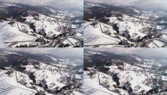 冬季山区滑雪场运动村的鸟瞰图高清在线视频素材下载
