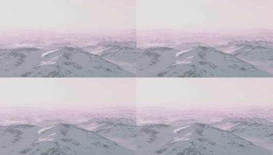 日落时白雪覆盖的山脉和粉红色的天空高清在线视频素材下载