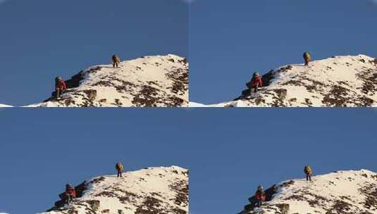 攀登四川岷山山脉主峰雪宝顶雪峰的登山队高清在线视频素材下载