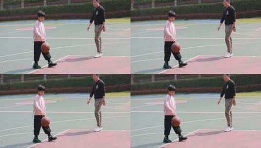 亚洲父亲和儿子在篮球场打篮球慢镜高清在线视频素材下载