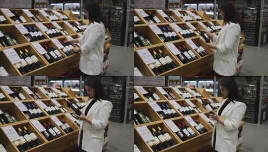 亚洲女性正在超市选购红酒高清在线视频素材下载